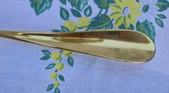 Custom made high end long-handled shoe horn. Casten brass and dark wooden handle